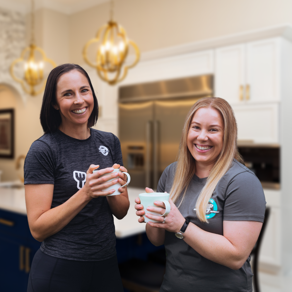 The two lead Compeat Academy dietitians Alicia and Demi holding coffee.