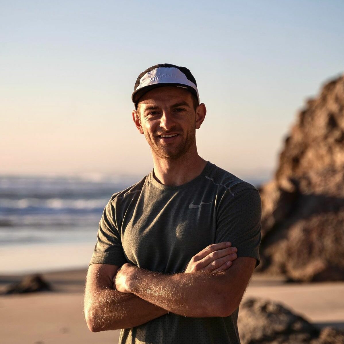 Matthew Hart Headshot Matthew Hart standing on a beach.